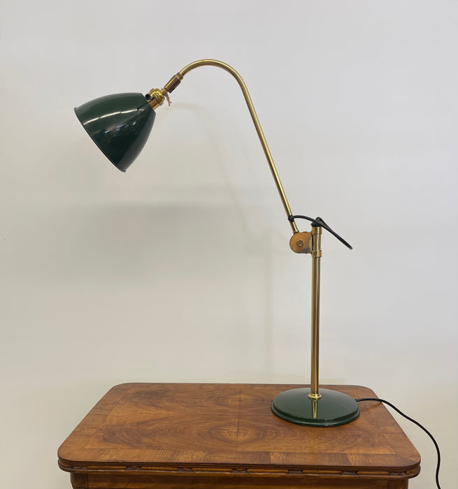 Vintage Adjustable Green and Brass Toned Desk Lamp with Articulated Arm and weighted base.