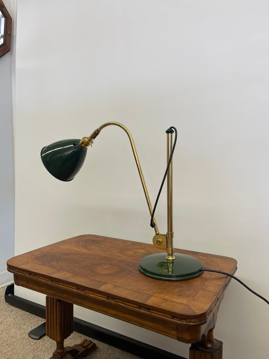 Vintage Adjustable Green and Brass Toned Desk Lamp with Articulated Arm and weighted base.
