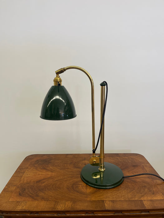 Vintage Adjustable Green and Brass Toned Desk Lamp with Articulated Arm and weighted base.
