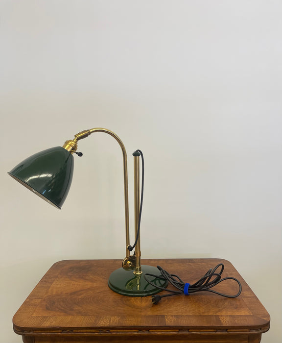 Vintage Adjustable Green and Brass Toned Desk Lamp with Articulated Arm and weighted base.