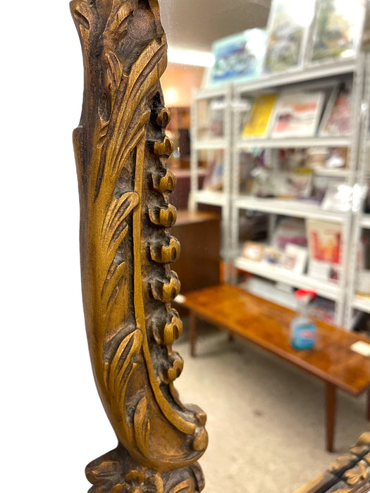 French Louis XV Style Carved Giltwood Wall Mirror with Shell Crest and Floral Details