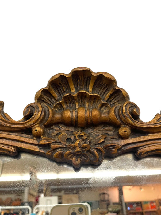 French Louis XV Style Carved Giltwood Wall Mirror with Shell Crest and Floral Details