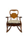 Likely Antique Victorian Style Solid Wood Rocking Chair with Carved Arms and Floral Cushion