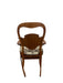 Likely Antique Victorian Style Solid Wood Rocking Chair with Carved Arms and Floral Cushion