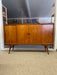 Mid-Century Danish Modern Likely Teak Credenza with Sculpted Base, Likely Rosewood Drawer Fronts with Brass toned Pulls