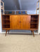 Mid-Century Danish Modern Likely Teak Credenza with Sculpted Base, Likely Rosewood Drawer Fronts with Brass toned Pulls