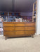 Mid-Century Modern Likely Walnut Nine-Drawer Dresser with Sculpted Pulls, Dovetail Drawers, and Tapered Legs