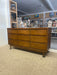 Mid-Century Modern Likely Walnut Nine-Drawer Dresser with Sculpted Pulls, Dovetail Drawers, and Tapered Legs