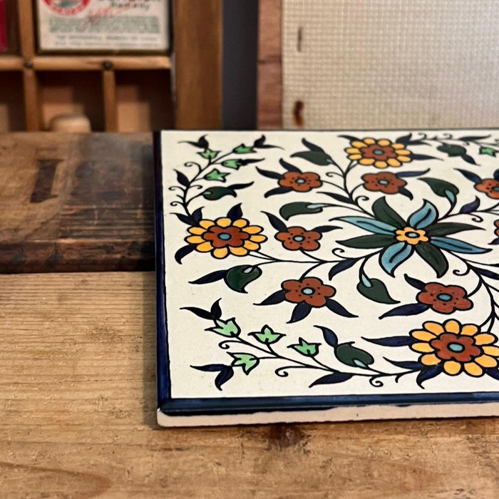 Vintage Ceramic Tile Depicting a Hand Painted Floral Design.(online purchase only)
