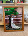 Vintage Stained Glass Art Panel Depicting Woman in Flowing White Dress Beneath Tree with Fruit, Framed in Wooden Oak Toned Frame