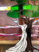 Vintage Stained Glass Art Panel Depicting Woman in Flowing White Dress Beneath Tree with Fruit, Framed in Wooden Oak Toned Frame