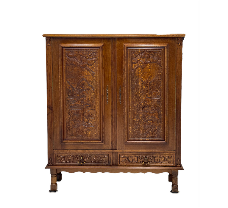 Vintage cabinet from Germany With Hand Carved Motifs. Circa 1930s