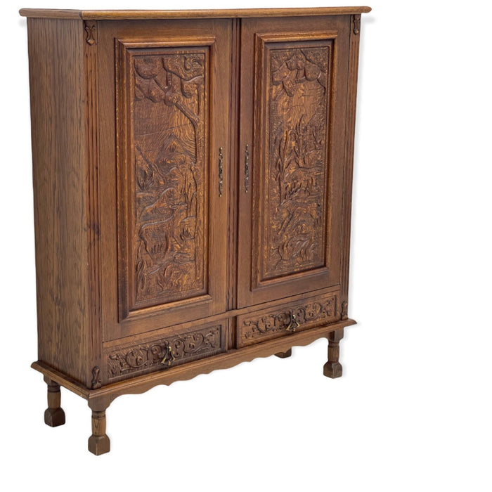 Vintage cabinet from Germany With Hand Carved Motifs. Circa 1930s